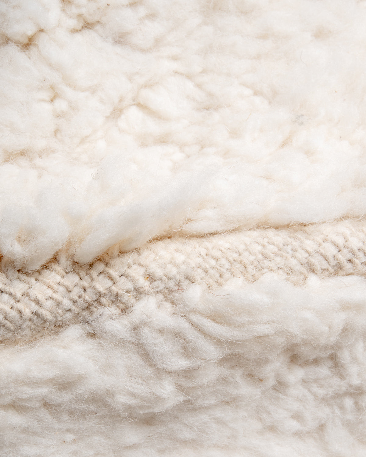 Modern, designer, handcrafted Berber rug from Morocco. Beniourain carpet with minimalist design, natural wool pile and a fluffy texture.